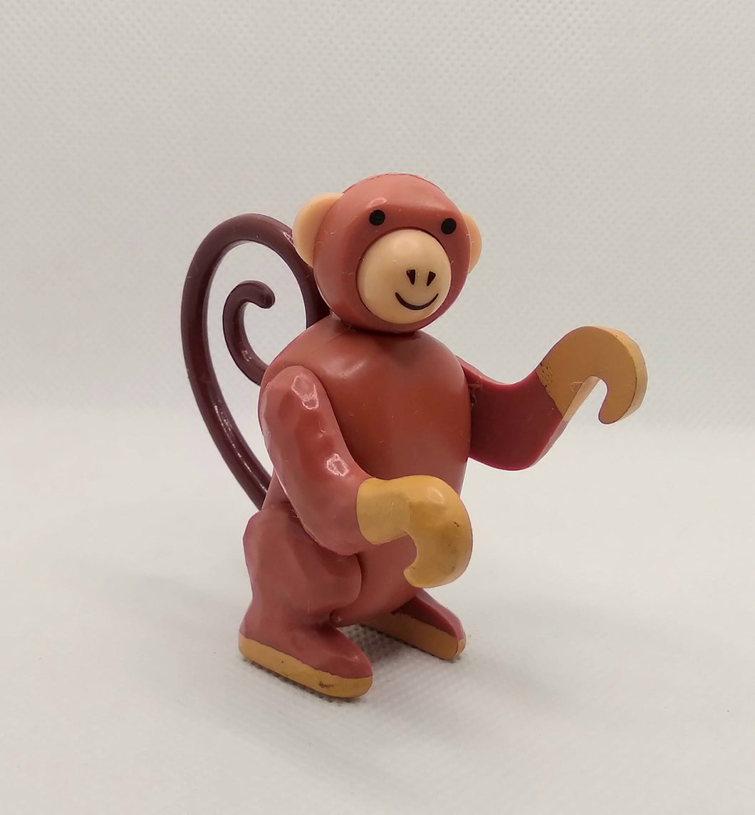 Circus Monkey with light brown tail